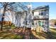 Backyard view of a two story home featuring a deck and a chimney at 2901 Alder Ridge Ln, Raleigh, NC 27603