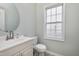 Well-lit half bathroom with a modern sink, fixtures, and ample space for everyday convenience at 2901 Alder Ridge Ln, Raleigh, NC 27603