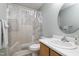 Comfortable bathroom features a stylish vanity, mirror, shower, and ample lighting for a tranquil experience at 2901 Alder Ridge Ln, Raleigh, NC 27603