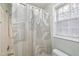Shower with a curtain inside of the primary bathroom at 2901 Alder Ridge Ln, Raleigh, NC 27603