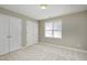 Bedroom with double closets and window at 2901 Alder Ridge Ln, Raleigh, NC 27603