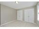 Neutral bedroom with two closets, beige walls and plush carpeting for a serene and inviting space at 2901 Alder Ridge Ln, Raleigh, NC 27603