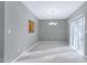 Dining area with neutral walls, carpeted floor, and chandelier at 2901 Alder Ridge Ln, Raleigh, NC 27603