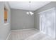Simple dining room with chandelier and sliding glass doors at 2901 Alder Ridge Ln, Raleigh, NC 27603