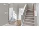 Spacious entryway with stairs, powder room and wood-look flooring at 2901 Alder Ridge Ln, Raleigh, NC 27603