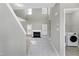 Bright entryway with vaulted ceilings, fireplace, and laundry access at 2901 Alder Ridge Ln, Raleigh, NC 27603