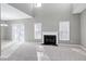 Spacious living room with a fireplace, high ceilings, and neutral decor at 2901 Alder Ridge Ln, Raleigh, NC 27603