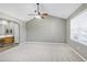 Spacious main bedroom featuring a ceiling fan, walk-in closet and en-suite bathroom at 2901 Alder Ridge Ln, Raleigh, NC 27603