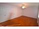 Well-lit bedroom with hardwood floors and double closets at 315 Lakeshore Dr, Hillsborough, NC 27278