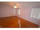Bright bedroom featuring hardwood floors and window blinds at 315 Lakeshore Dr, Hillsborough, NC 27278