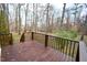 Wooden deck overlooking a wooded backyard at 315 Lakeshore Dr, Hillsborough, NC 27278