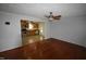 Open dining area with hardwood floors and kitchen view at 315 Lakeshore Dr, Hillsborough, NC 27278