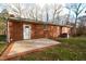 Brick home with a patio and a large backyard at 315 Lakeshore Dr, Hillsborough, NC 27278