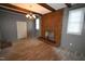 Living room featuring hardwood floors and exposed beams at 315 Lakeshore Dr, Hillsborough, NC 27278