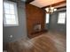 Living room with brick fireplace and hardwood floors at 315 Lakeshore Dr, Hillsborough, NC 27278