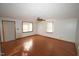 Bright living room with hardwood floors and large windows at 315 Lakeshore Dr, Hillsborough, NC 27278