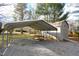 Gray storage shed with carport and gravel area at 315 Lakeshore Dr, Hillsborough, NC 27278