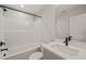 Bathroom featuring a bathtub with shower, black hardware, white cabinets, and a mirror at 320 Pilot Ridge Rd, Zebulon, NC 27597