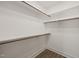 This walk-in closet comes with wooden rods, offering functional storage space at 320 Pilot Ridge Rd, Zebulon, NC 27597