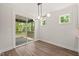 The dining room has a sliding door that leads to a deck and a light fixture at 320 Pilot Ridge Rd, Zebulon, NC 27597