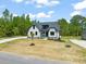 Charming two-story home with a well-manicured lawn and a paved driveway at 320 Pilot Ridge Rd, Zebulon, NC 27597