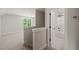 Hallway with carpeted floors and an open bathroom with a bathtub and shower combination at 320 Pilot Ridge Rd, Zebulon, NC 27597
