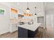 This spacious kitchen features new appliances, a center island, and custom cabinetry for a modern feel at 320 Pilot Ridge Rd, Zebulon, NC 27597