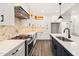 Well-equipped kitchen featuring stainless steel appliances, a gas range, and ample counter space with an island at 320 Pilot Ridge Rd, Zebulon, NC 27597
