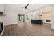 The living room has a fireplace and a view of the kitchen and the screened deck at 320 Pilot Ridge Rd, Zebulon, NC 27597