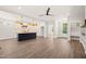 The living room has a kitchen and a door that leads to the front yard at 320 Pilot Ridge Rd, Zebulon, NC 27597
