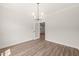 The living room features a light fixture and a door that leads to another room at 320 Pilot Ridge Rd, Zebulon, NC 27597