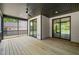 Spacious screened porch featuring a ceiling fan and sliding glass doors to the backyard at 320 Pilot Ridge Rd, Zebulon, NC 27597