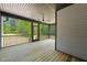 Screened-in porch with wooden flooring and a beautiful backyard view at 320 Pilot Ridge Rd, Zebulon, NC 27597