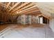 Unfinished room with wooden beams and drywall at 320 Pilot Ridge Rd, Zebulon, NC 27597