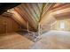 Unfinished room with wooden beams and exposed plywood at 320 Pilot Ridge Rd, Zebulon, NC 27597