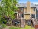 A view of backyard featuring decks, stairs, and the back exterior of the multi-story townhome at 4541 Hershey Ct, Raleigh, NC 27613