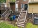 Backyard with wooden stairs and a small patch of grass at 4541 Hershey Ct, Raleigh, NC 27613