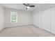 This bedroom features carpet, and a large closet for storage at 4541 Hershey Ct, Raleigh, NC 27613