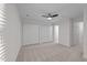 Bright bedroom with large closets, carpet, and a ceiling fan at 4541 Hershey Ct, Raleigh, NC 27613