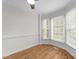 Bright dining area featuring wood floors, bay window, and fresh paint at 4541 Hershey Ct, Raleigh, NC 27613