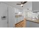 Bright kitchen featuring white cabinets, granite countertops, modern appliances, and wood flooring at 4541 Hershey Ct, Raleigh, NC 27613