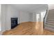 Cozy living room features a fireplace, hardwood floors, and built-in shelving at 4541 Hershey Ct, Raleigh, NC 27613