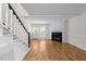 Spacious living room with hardwood floors, fireplace, and ample natural light at 4541 Hershey Ct, Raleigh, NC 27613