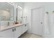 Modern bathroom with double vanity and large mirror at 504 Branch St, Raleigh, NC 27601