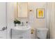 Clean bathroom with vanity, toilet and window at 504 Branch St, Raleigh, NC 27601