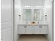 Modern bathroom with double vanity and large mirror at 504 Branch St, Raleigh, NC 27601