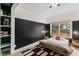 Bedroom with wood bed frame, built-in shelves, and window at 504 Branch St, Raleigh, NC 27601