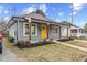 Gray craftsman home with a welcoming front porch and landscaping at 504 Branch St, Raleigh, NC 27601