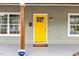Bright yellow front door with wood trim accents at 504 Branch St, Raleigh, NC 27601