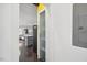 Hallway view of kitchen and laundry area with frosted glass door at 504 Branch St, Raleigh, NC 27601